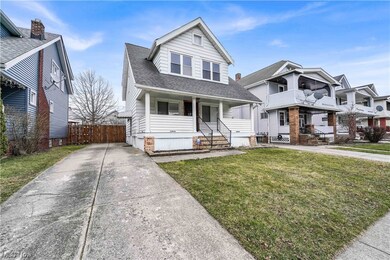 View of front of property featuring a front yard and covered porch