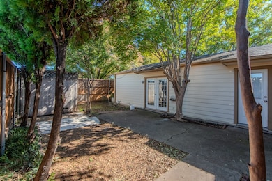 Rear view of property with a patio area, french doors, and a fenced backyard