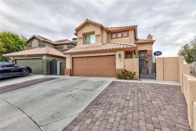Mediterranean / spanish-style house featuring a ti