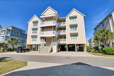 View of property with stairway and a carport