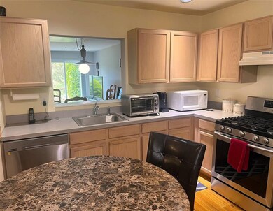 Kitchen featuring appliances with stainless steel 