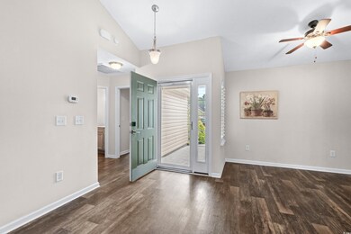 Entrance foyer with ceiling fan, dark hardwood / w