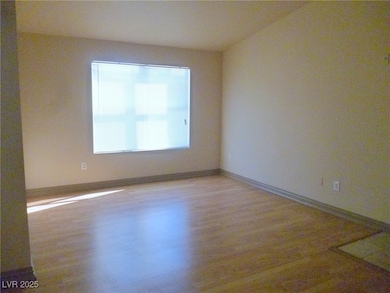 Empty room with light wood-type flooring and baseb