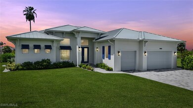 View of front of house featuring stucco siding, a