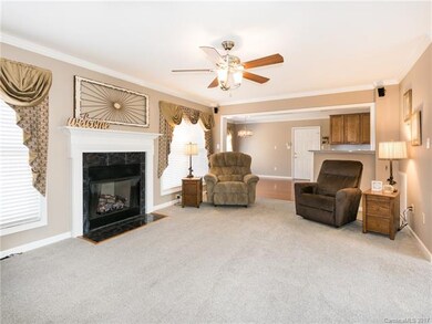 Large living room with cozy fireplace that leads i