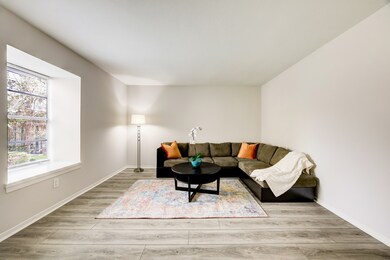 The light-filled spacious living room with warm wo