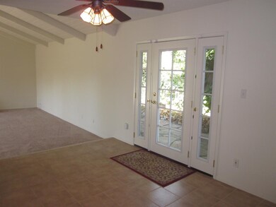 Formal dining room with French Doors out to yard.
