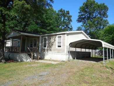 View of front of home featuring a carport and a fr