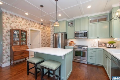 Bright kitchen featuring a convenient breakfast bar—perfect for quick meals or morning coffee.