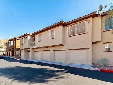 Back of property with stucco siding and an attache