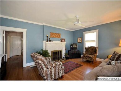 Spacious Living Room with crown molding and pretty