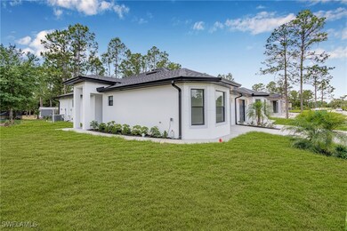 Back of house with a lawn, central AC unit, roof w