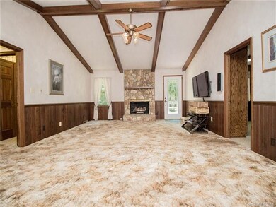 Beamed vaulted Great Room with stone fireplace and