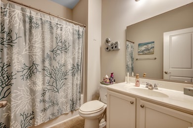 Full bathroom with tile patterned floors, vanity, 