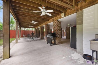 Open Patio and fenced under the home for privacy.