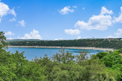 Water view featuring a forest