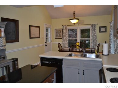 Breakfast nook with new skylights and door to deck