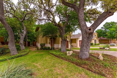View of front facade featuring stucco siding, a f