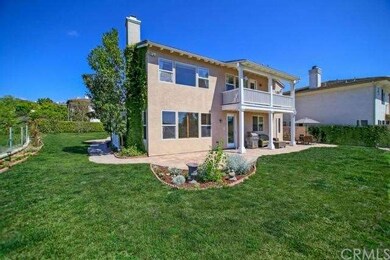 Huge wrap around yard features a covered patio, am