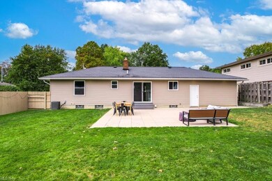 Back of property featuring a patio area, central a