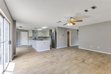 Kitchen featuring stainless steel fridge, ceiling