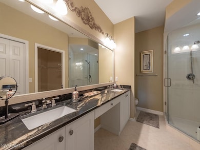 Bathroom with tile patterned flooring, vanity, a s