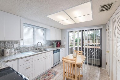White bright kitchen with room for a dinette.