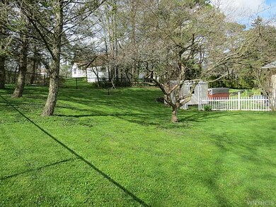 Backyard. Side yard showing fully fenced yard, she