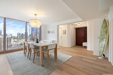 DINING AREA WITH DESIGNER CHANDELIER AND CITY VIEW