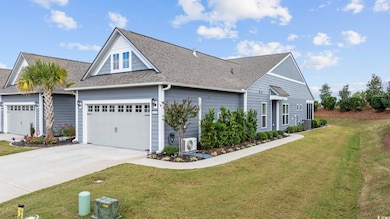 View of front facade with ac unit, central AC, and a front lawn