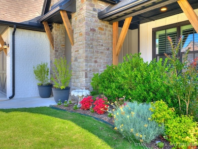 Amazing landscaping in the front.  Potted plants s