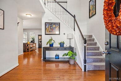 Foyer with hardwood / wood-style flooring