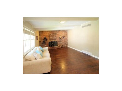 Family room with beams and refinished pegged hardw