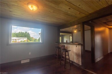 Dining Area with large picture window and view into Livingroom.