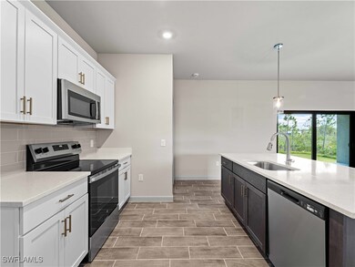 Kitchen featuring tasteful backsplash, stainless s