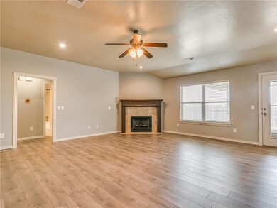 Large living room with corner fireplace. Fresh pai