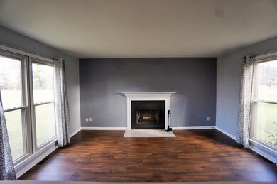 Wood fireplace in the living room of unit 7018.