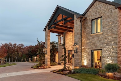 View of side of home with stone siding