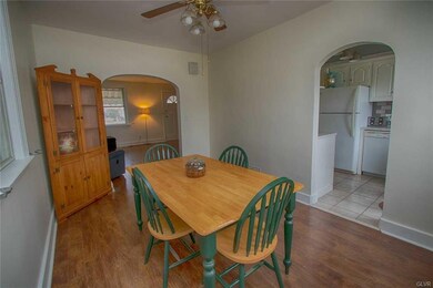 Dining room with ceiling fan.