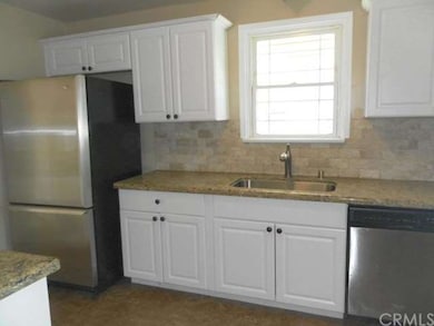 Updated kitchen with granite counter tops, stone b