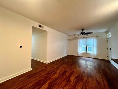 Unfurnished room with dark wood-type flooring and