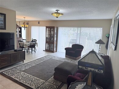 Living Room/Dining Room with 2 Sliding Doors to the Patio