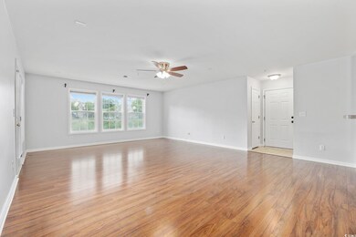 Unfurnished living room featuring light hardwood /