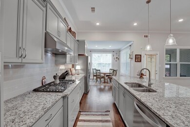 Kitchen with stainless steel appliances, hanging l