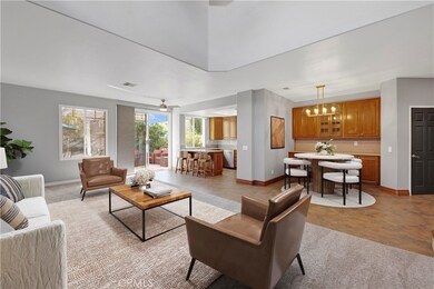 Another beautiful virtually staged view of the living room with the amazing kitchen in the background.