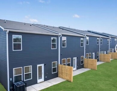 Rear view of property with a patio area