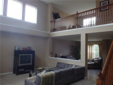 Two story entry with living room, great room and loft