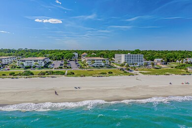 Birds eye view of property with a view of the beac