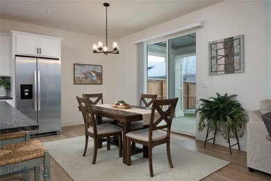 Large dining area, sliders to the patio and backya