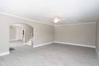 Stunning porcelain wood-look tile runs through the